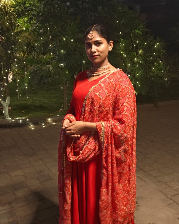 Sai Prasanna — traditional red dress